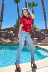 wet jeans girl under waterfall